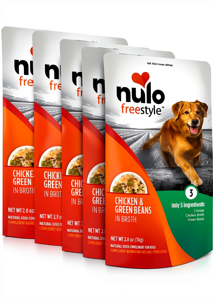 Nulo grain‑free dog topping pouch opened on a kitchen counter with a hand squeezing the contents